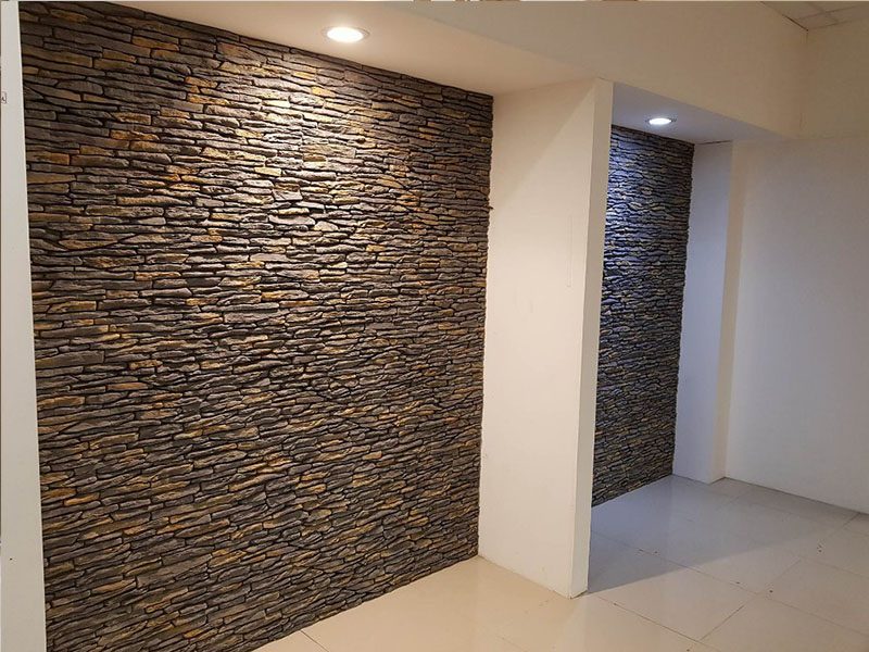 Textured stone cladding applied to a feature wall in Coimbatore